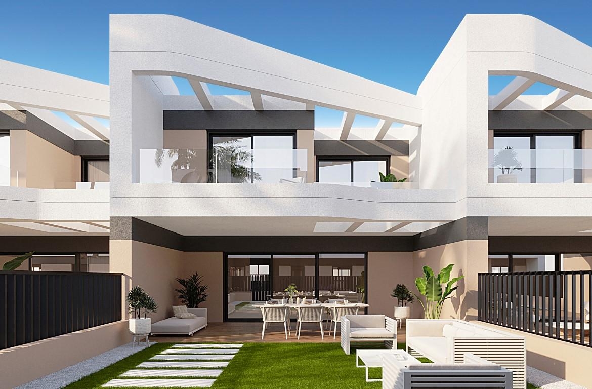 Townhouses overlooking Alicante Golf with modern designs and nearby beach access.