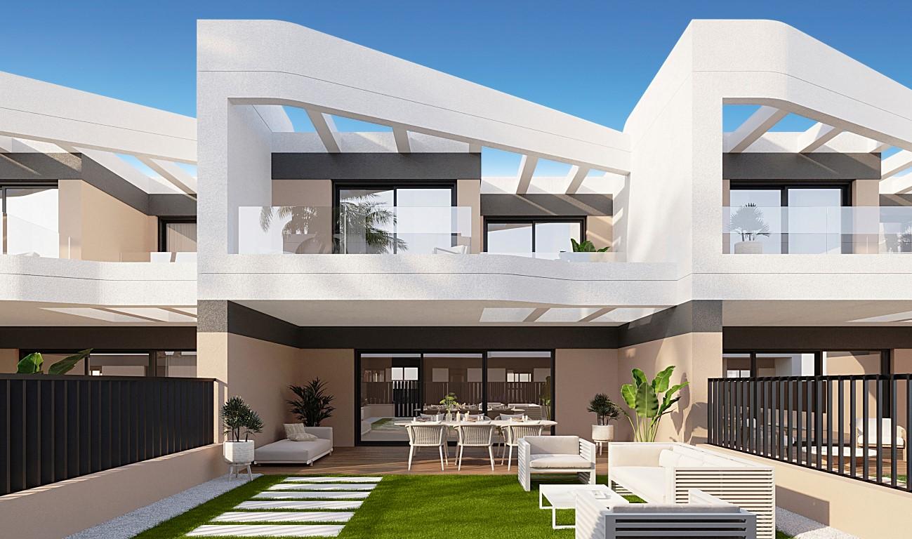 Townhouses overlooking Alicante Golf with modern designs and nearby beach access.